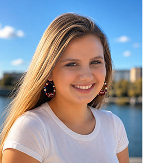 Woman wearing Red Buffalo Bling large hoop earrings
